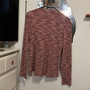 Maurice’s pink turtleneck